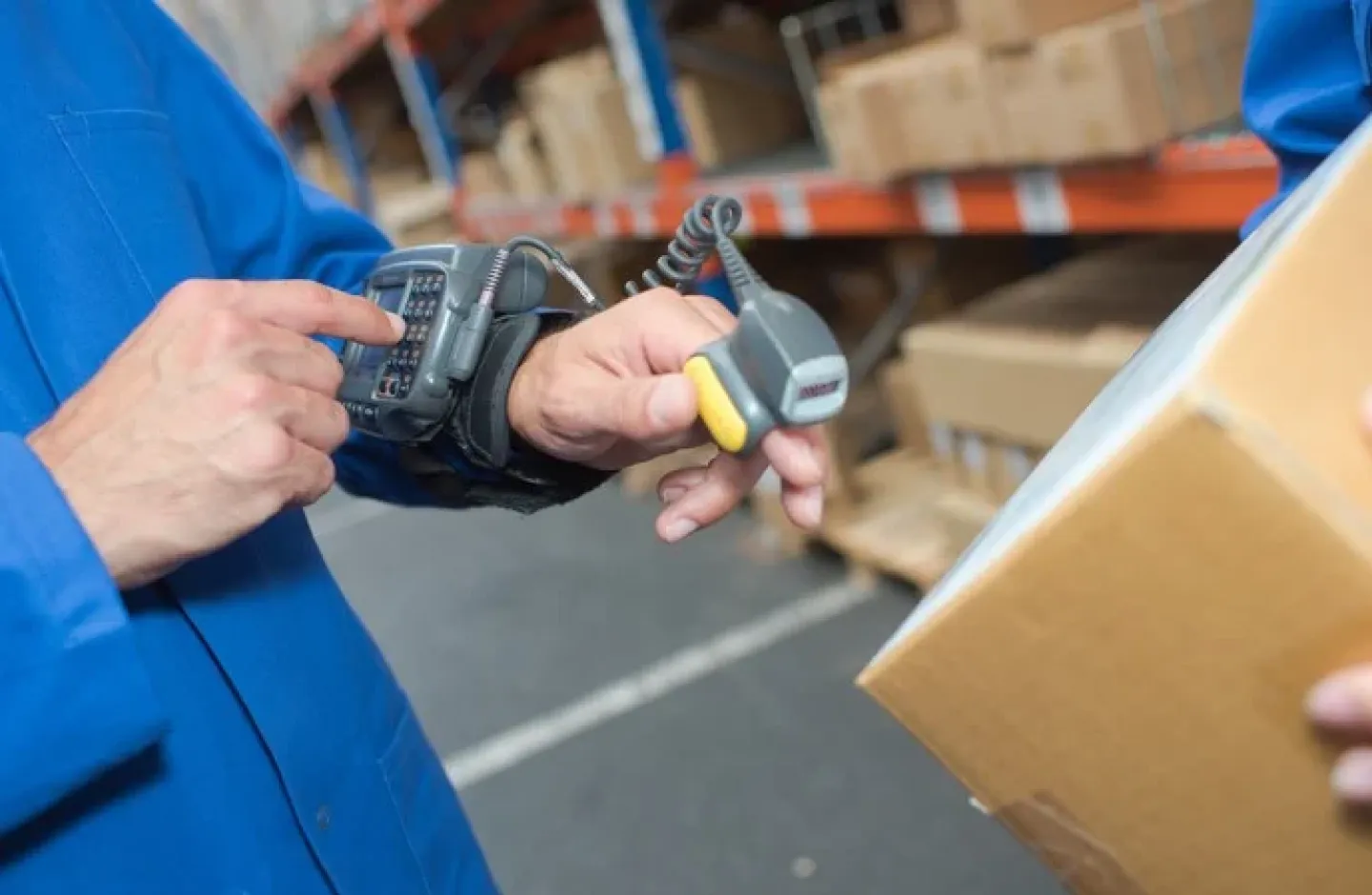 Warehouse worker using technology. A barcode scanner.