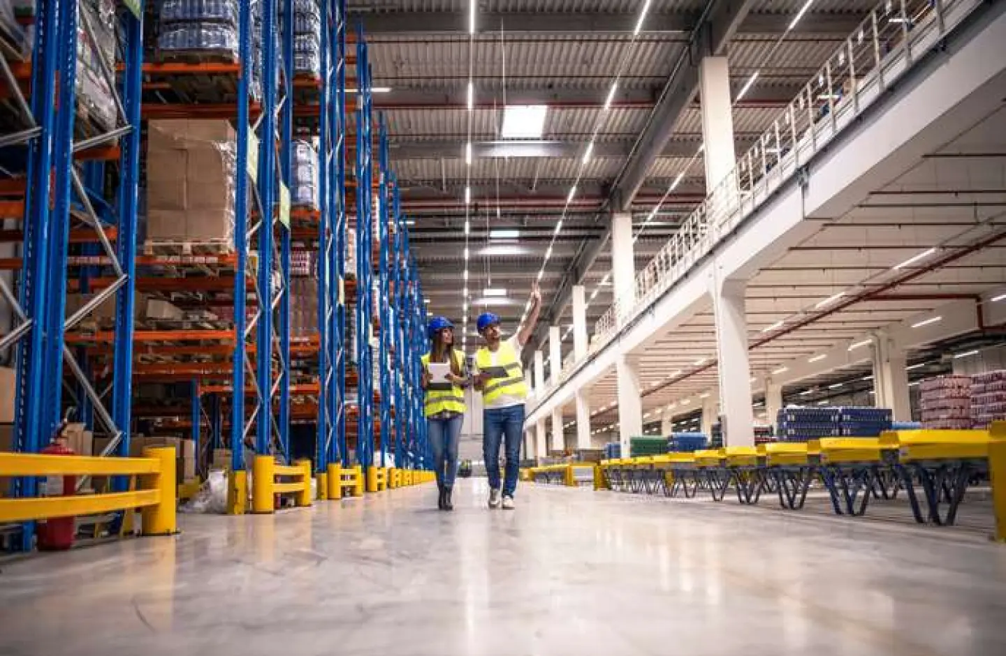 Warehouse managers discussing practical layout design.