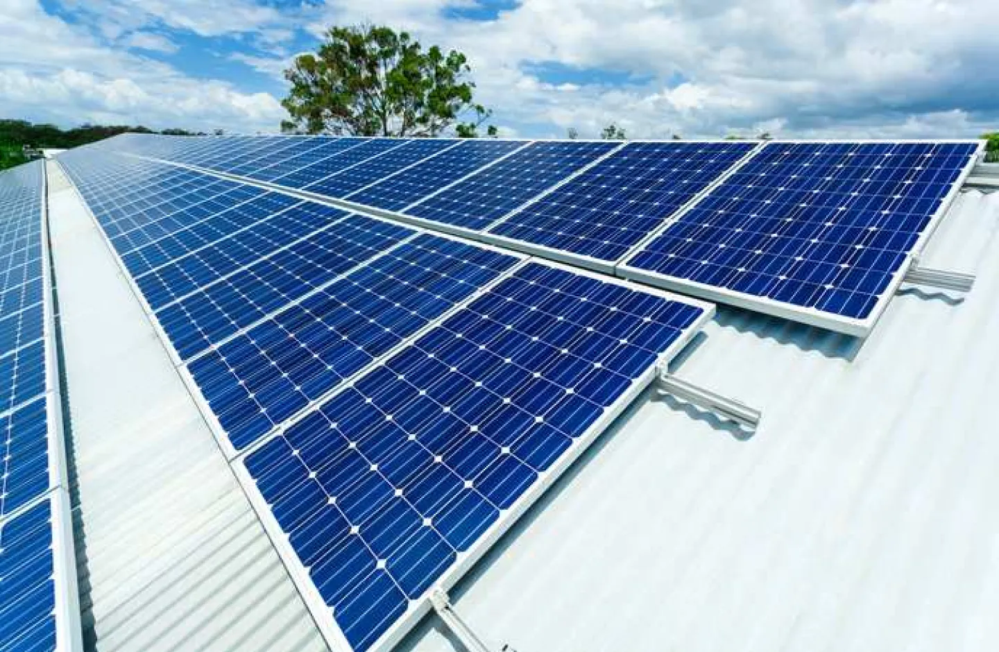 A warehouse with solar panels on the roof.