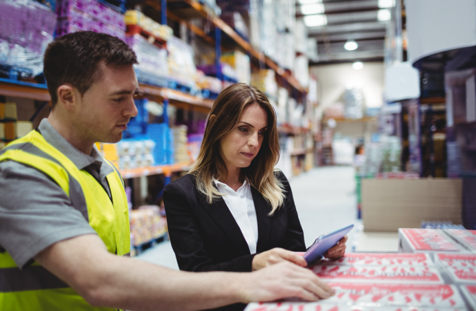 Warehouse manager and staff enforcing processes through warehouse workflow software. 