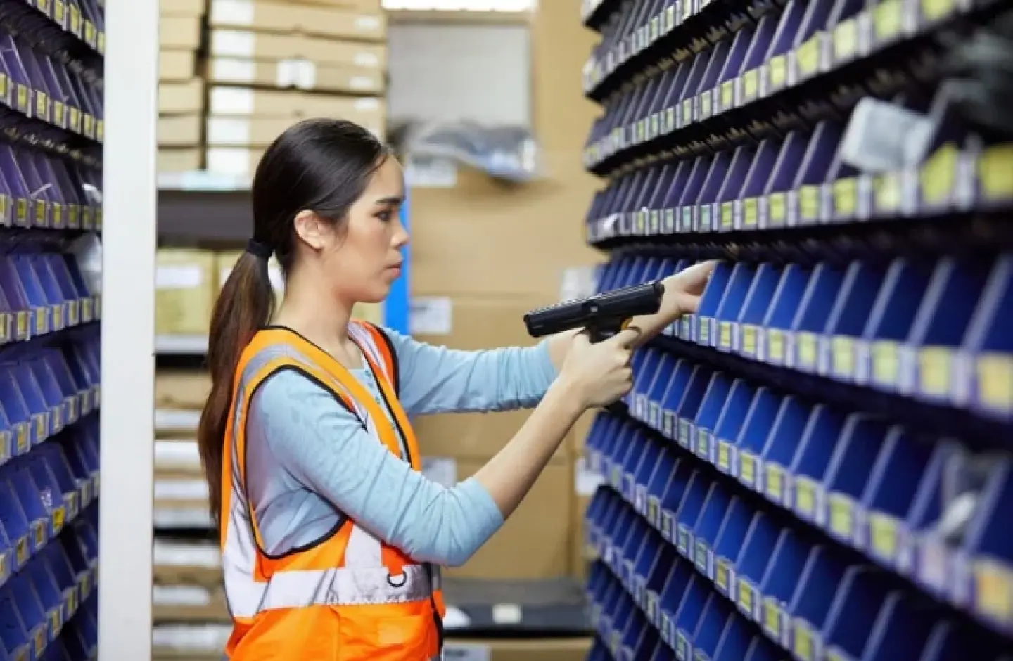 Employee picking in fulfillment center.